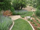 "Lutyens" style bench with mass planting of lavender and newly installed water feature